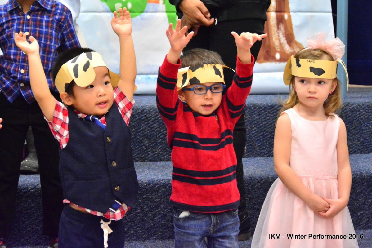 Three children in a school play.