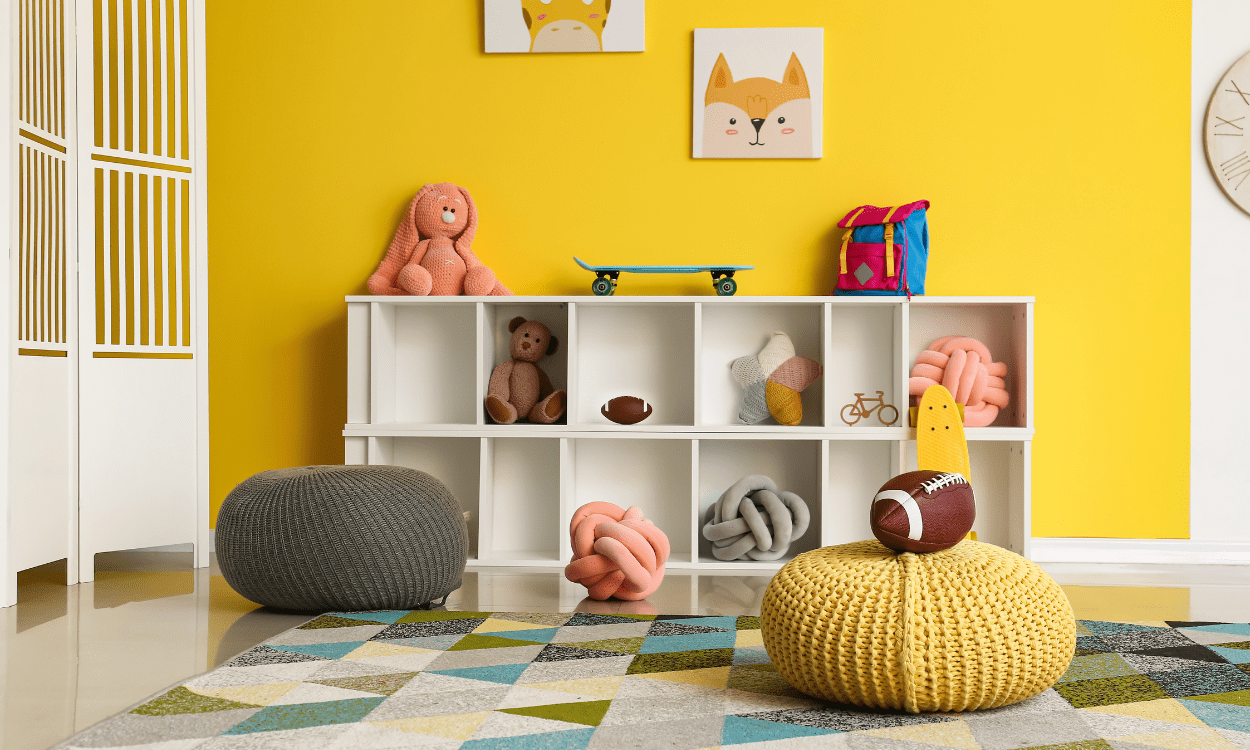 Kids' playroom with toys and storage.