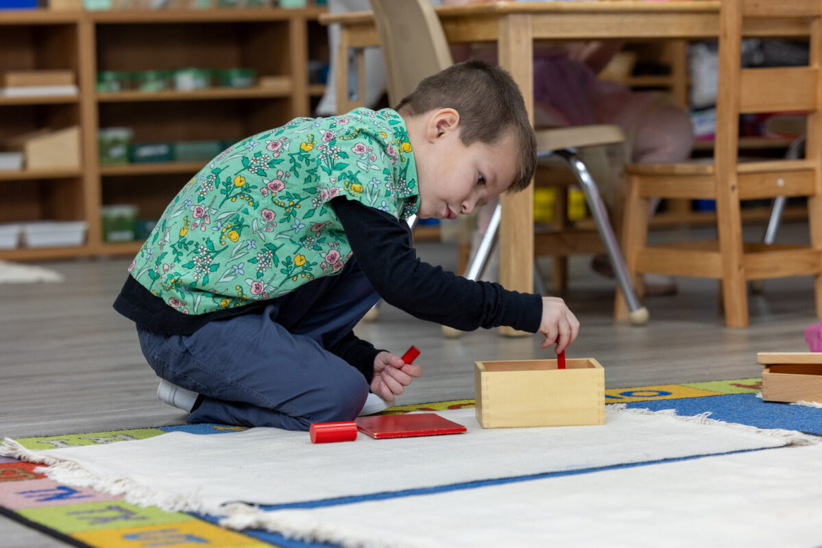 Pre-K completing Montessori work in a prepared classroom at Inspire Kids Montessori